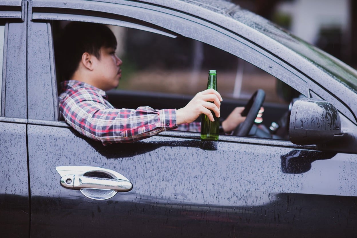 A man drinking while driving